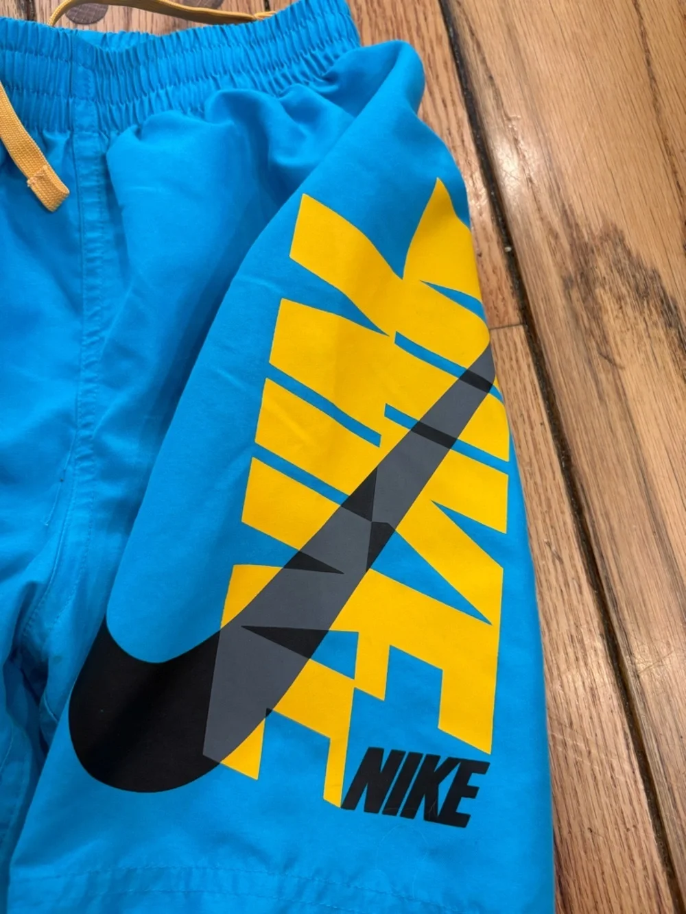 Nike Bright Blue and Orange lined Swim Shorts and Black Logo size small